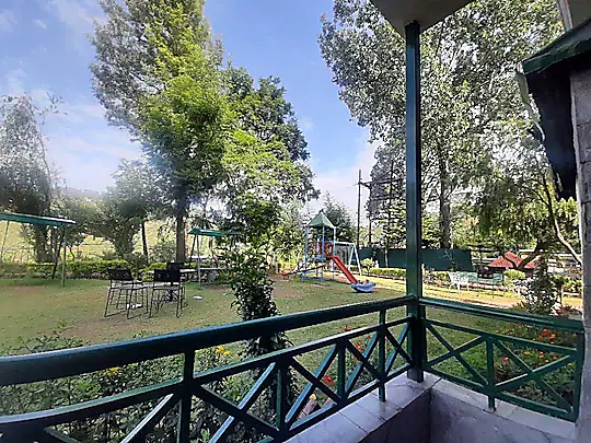 Children's play area on the lawn seen from a balcony