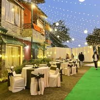 Lawn set with draped tables and chairs for an event