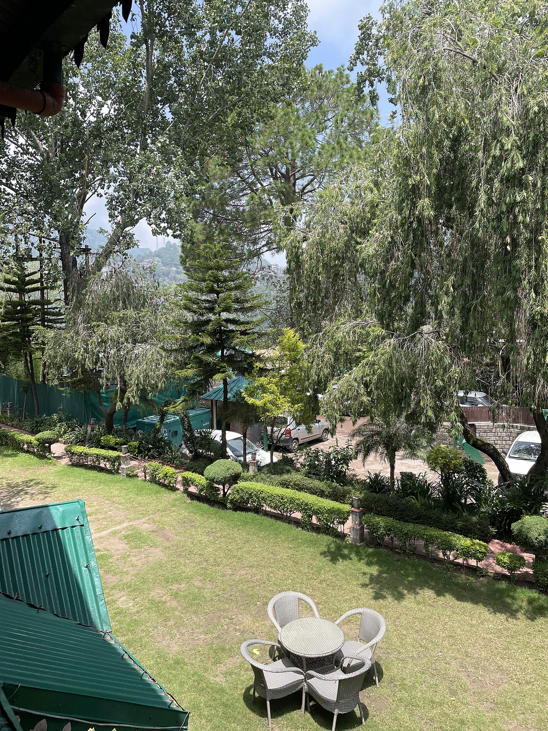 Green lawn and flower beds in front of the resort buildings